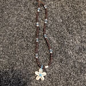 Brown Beaded Necklace with White Shell Flower Pendant and Blue Accents